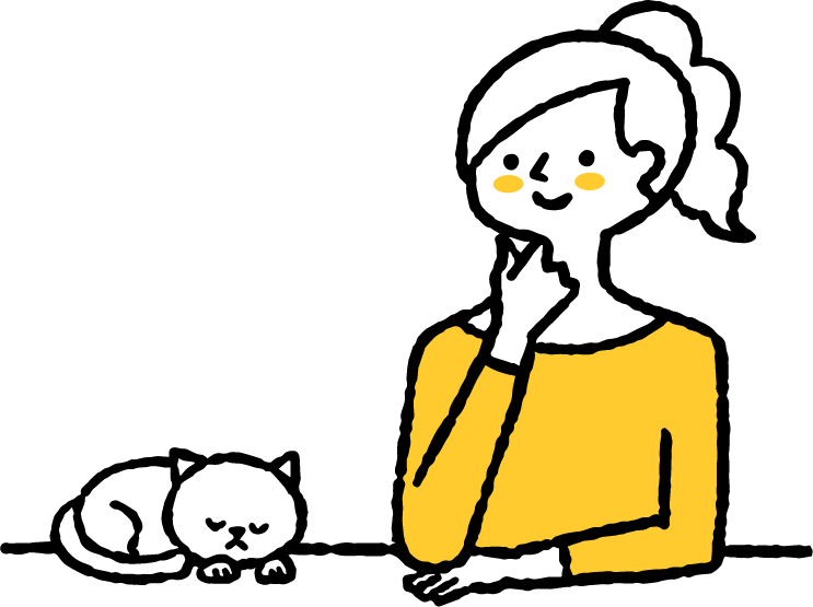 寝る猫とその猫を見つめる女性